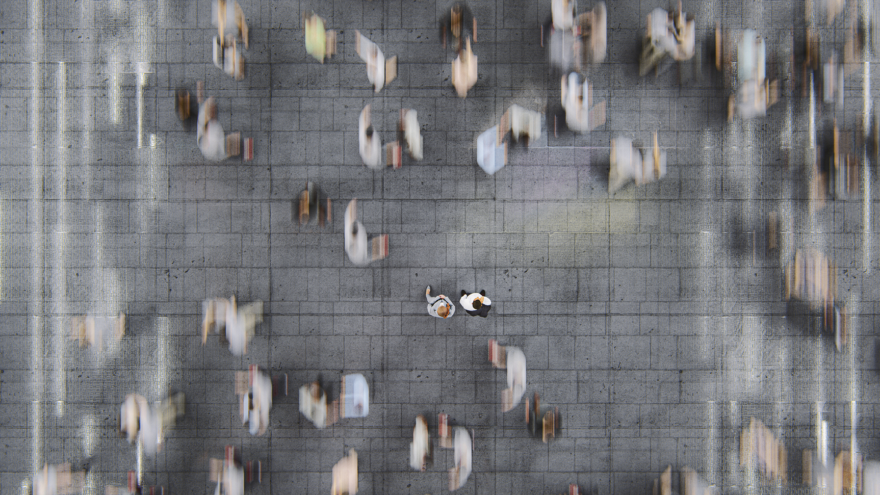 Businessman standing in the fast moving crowds of commuters. This is entirely 3D generated image.