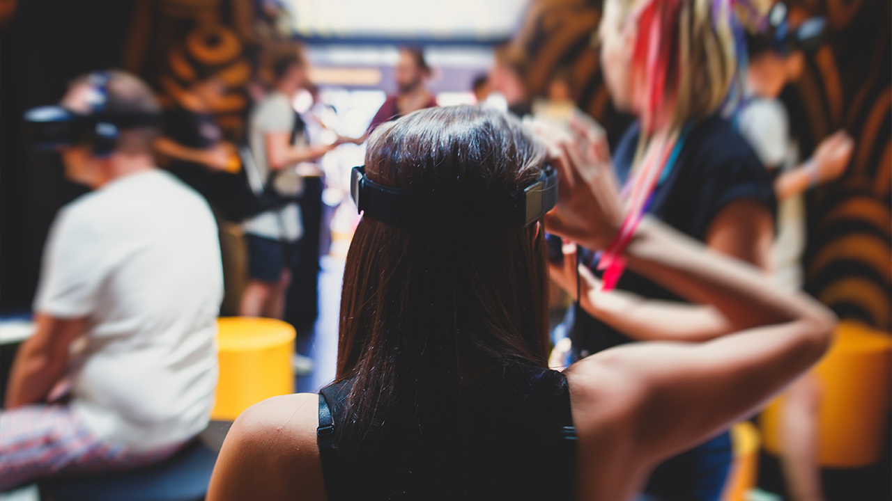 How to ensure your business is metaverse ready. Woman wearing VR headset