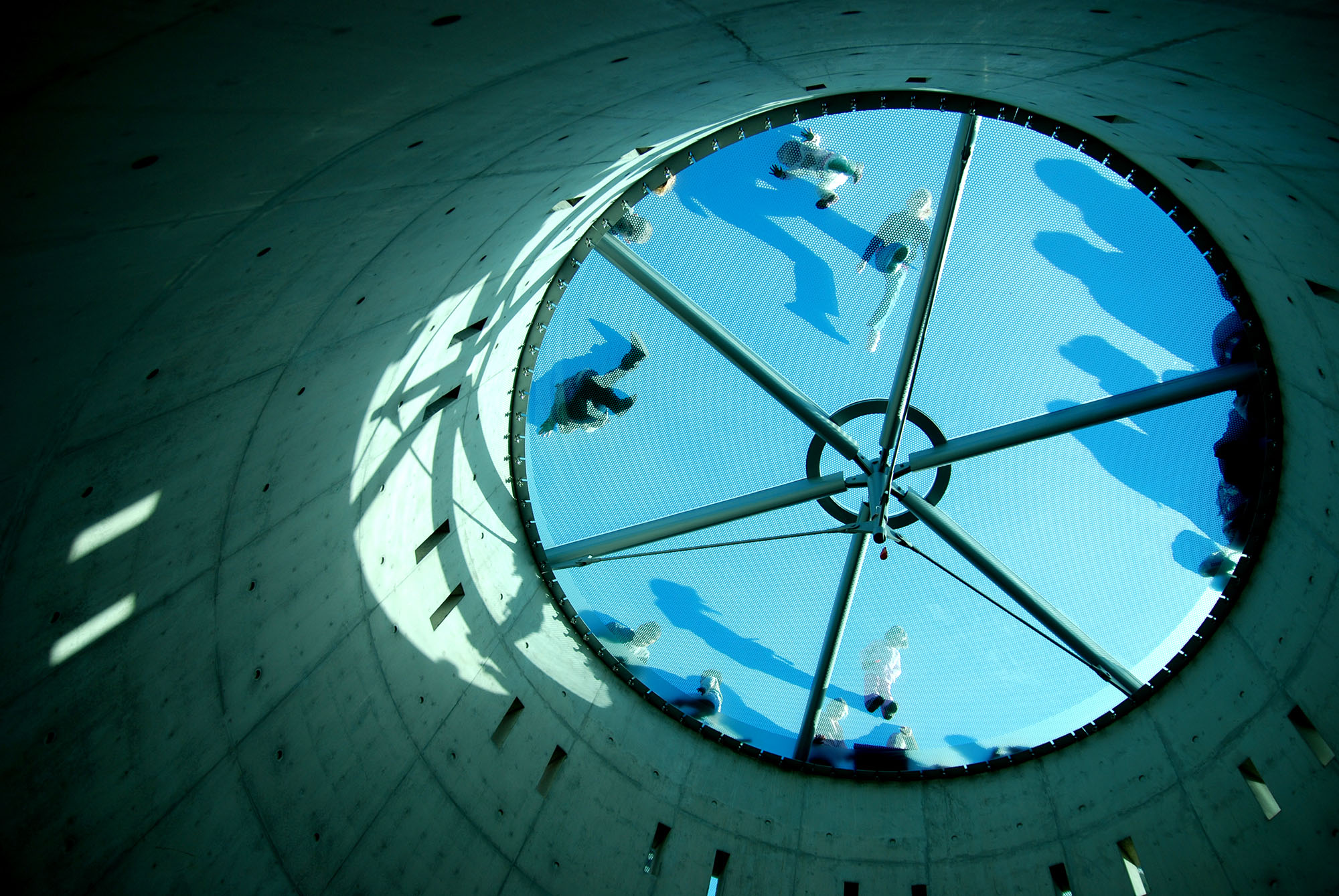 Below the round transparent blue sidewalk