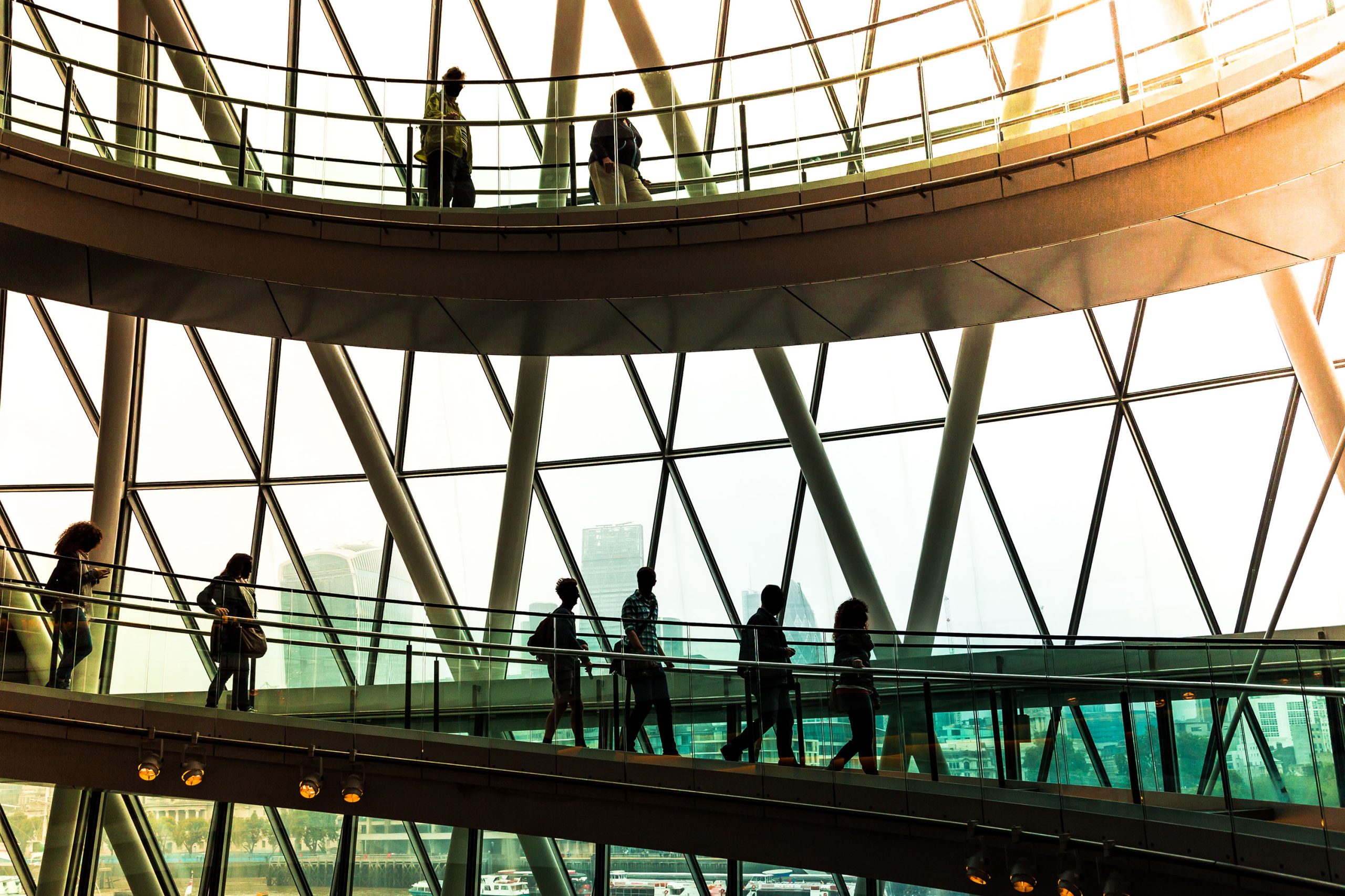 Abstract modern architecture and silhouettes of people on spiral staircase